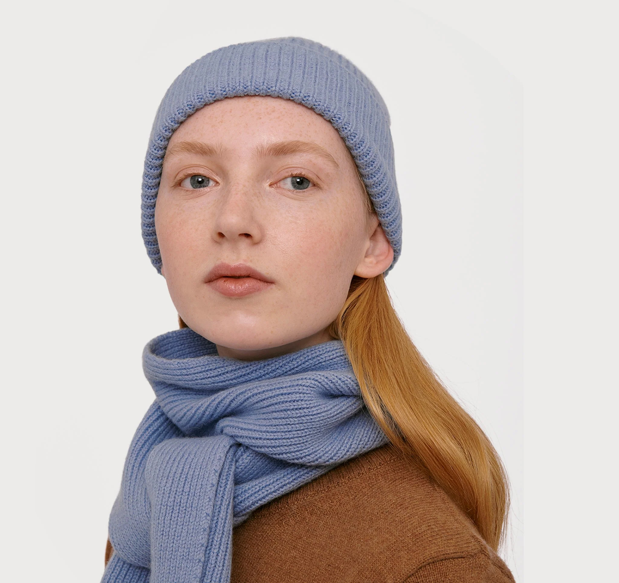 A model wearing an Organic Basics  sustainable scarf.