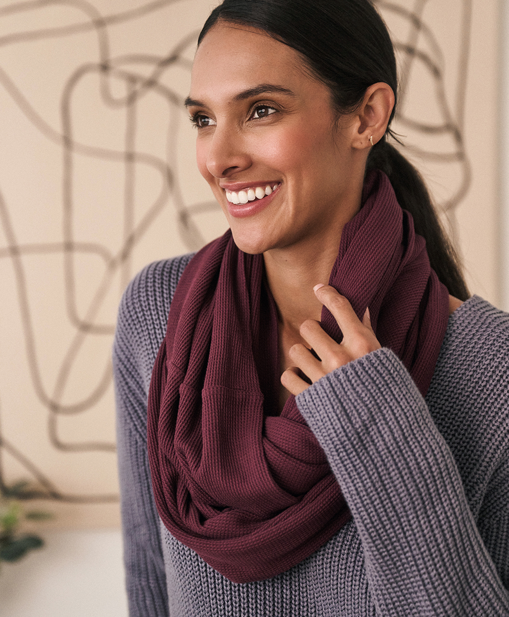 A model wearing a Pact sustainable scarf.