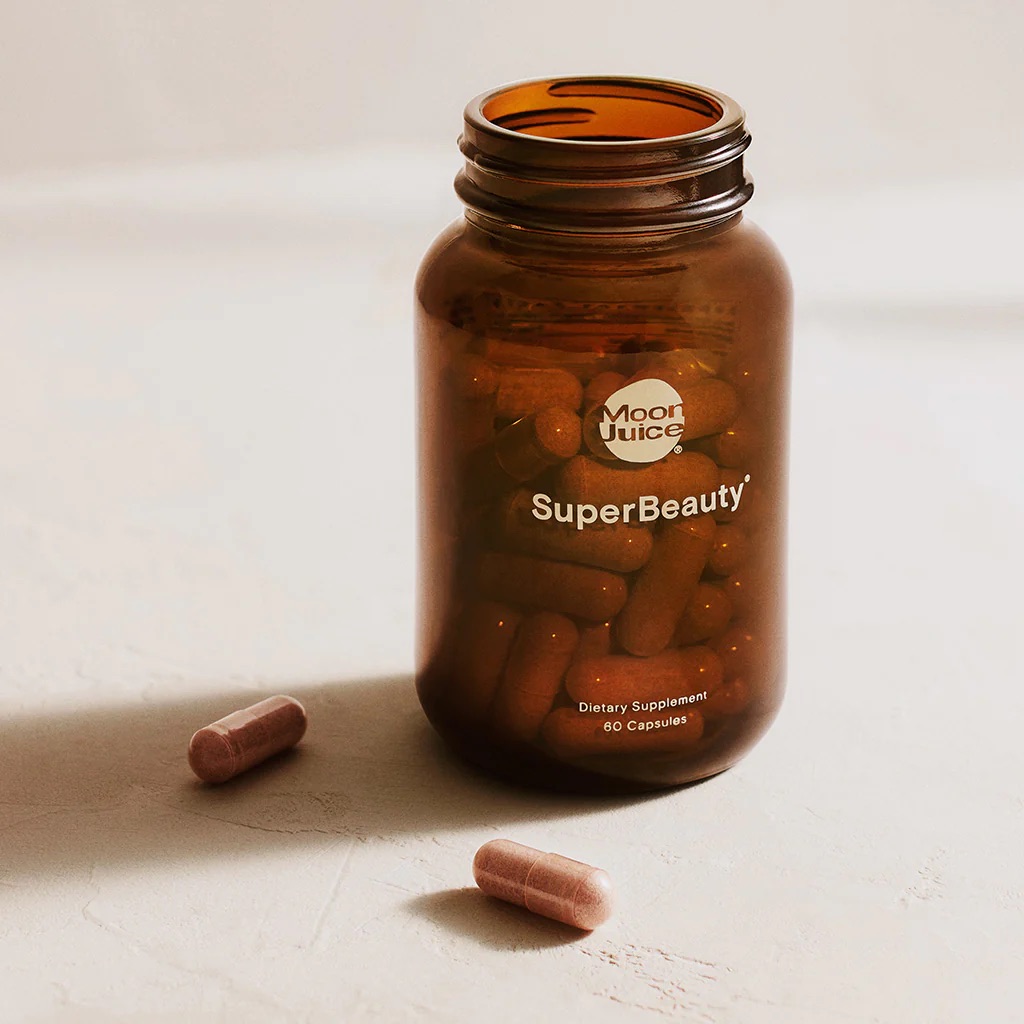 A open jar of Moon Juice's SuperBeauty capsules.
