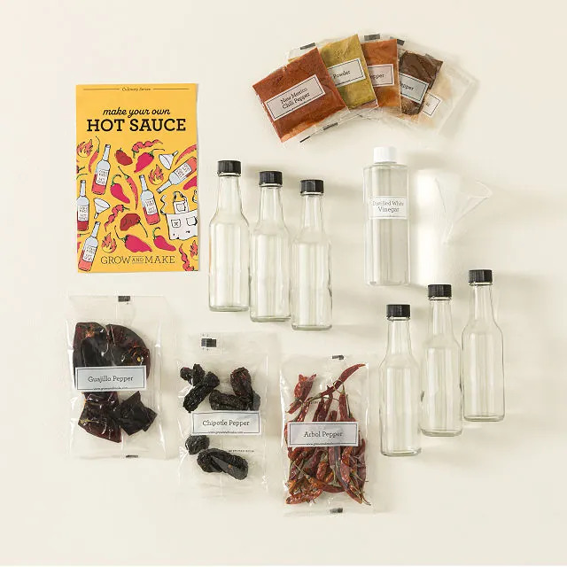 A flat lay of the items in a Grow And Make’s Make Your Own Hot Sauce Kit