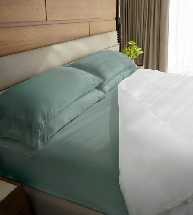 Teal Cariloha bamboo sheets on a bed. 