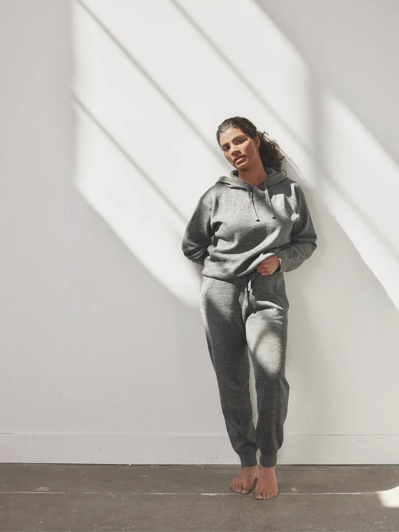 A model wearing a grey Avocado sweat set.