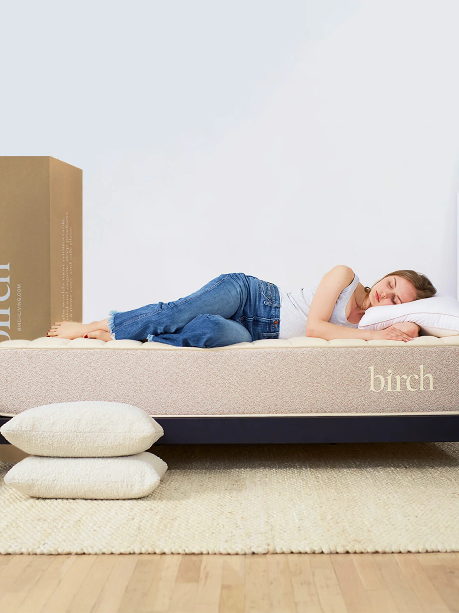 A woman lies on her Birch natural latex mattress