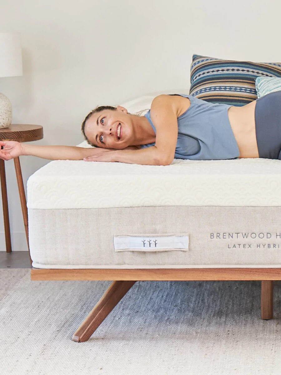 A woman lies across a Brentwood natural latex mattress.