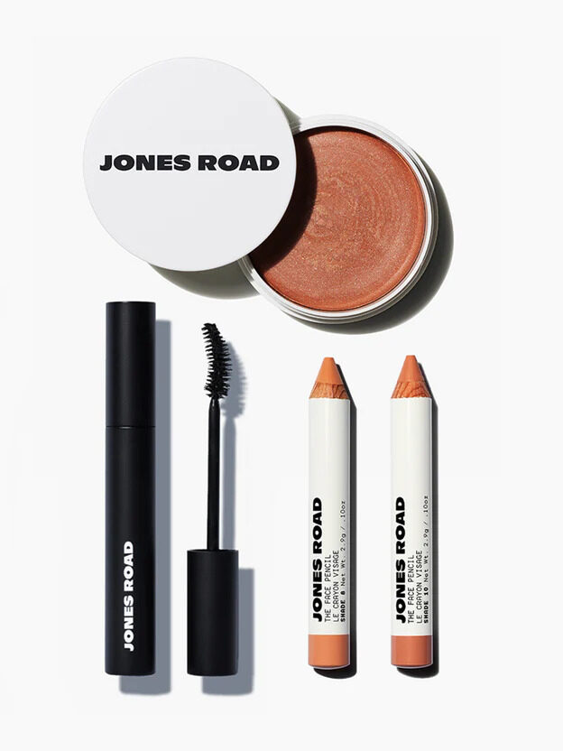 Jones Road mascara and face pencil displayed next to eachother with a cream product above them.