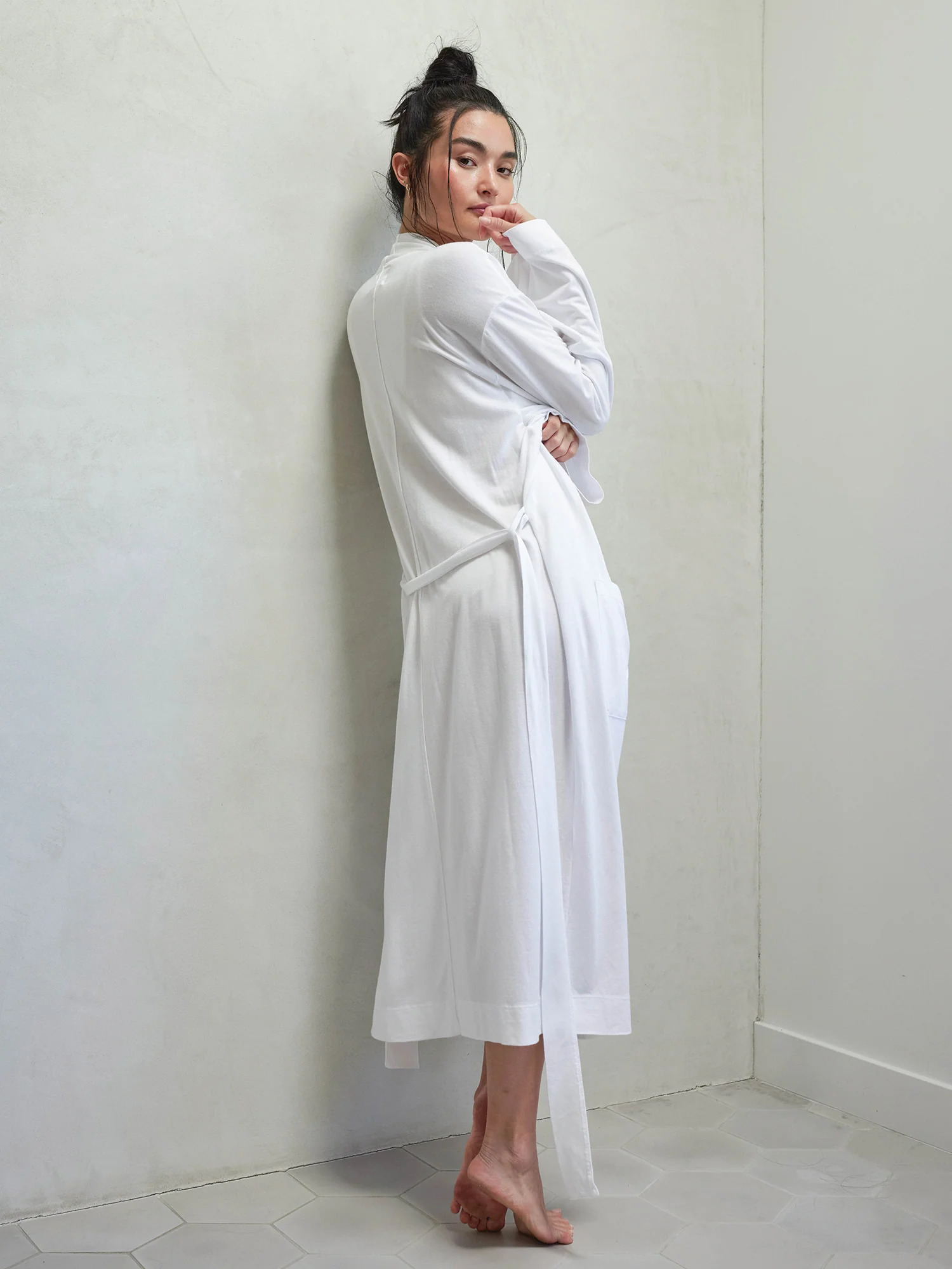 A model wearing MATE the Label's Tencel Robe in white.