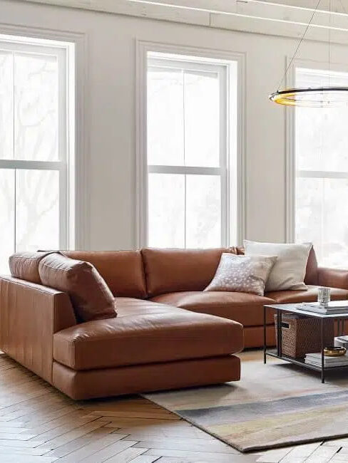 A leather sectional in a styled interior.