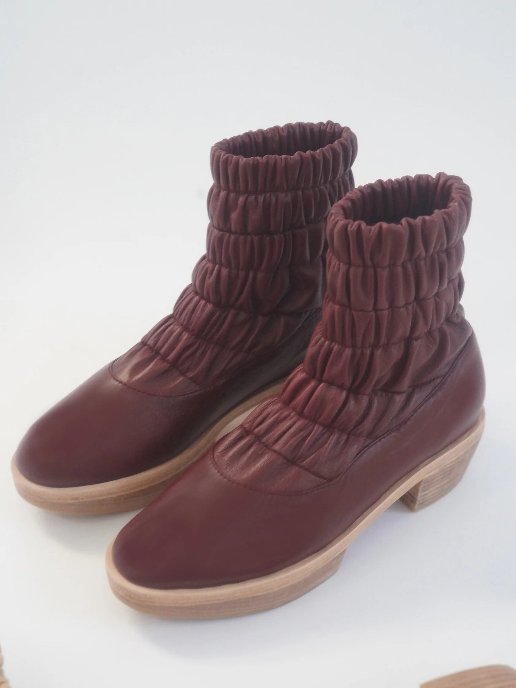 Beklina wine-colored sustainable winter clog boots.
