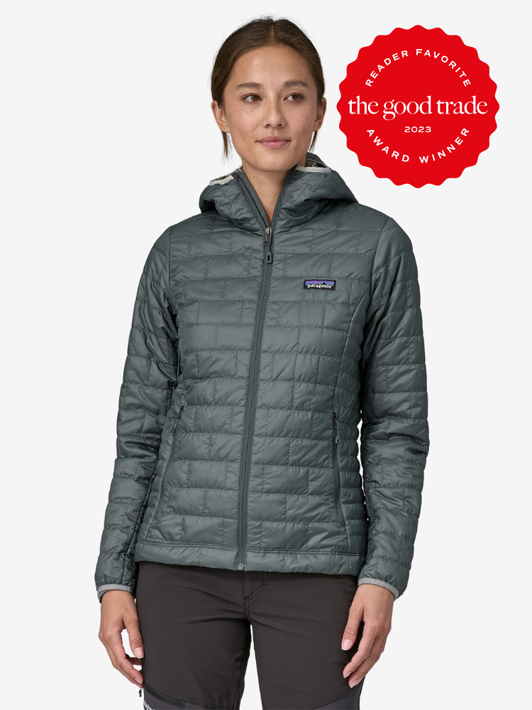 A model wearing a teal packable Patagonia puffer jacket. A red Reader Favorite Award 2023 sticker by The Good Trade is on the top right hand corner.