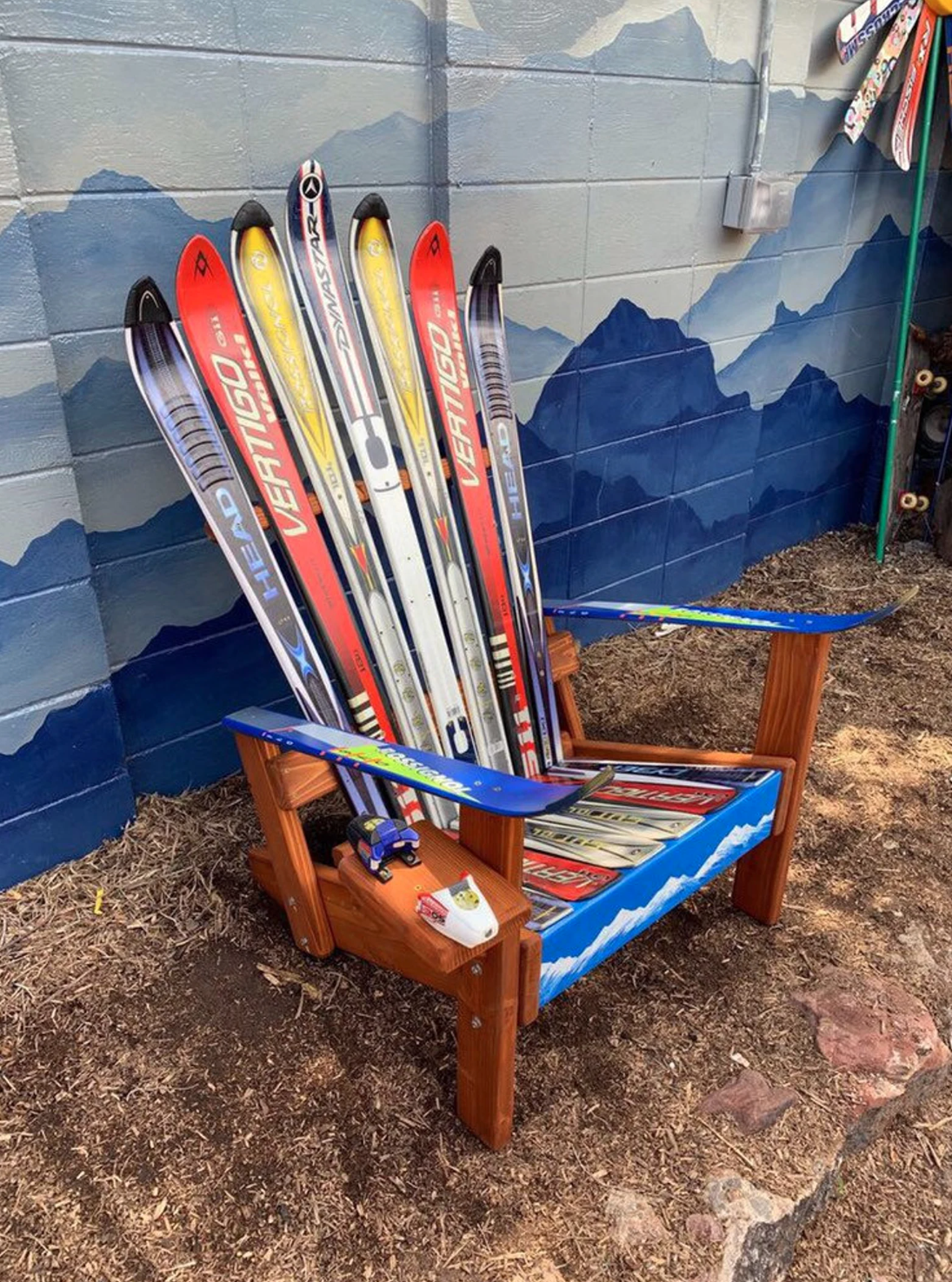 An adirondack-style chair made from upcycled skis