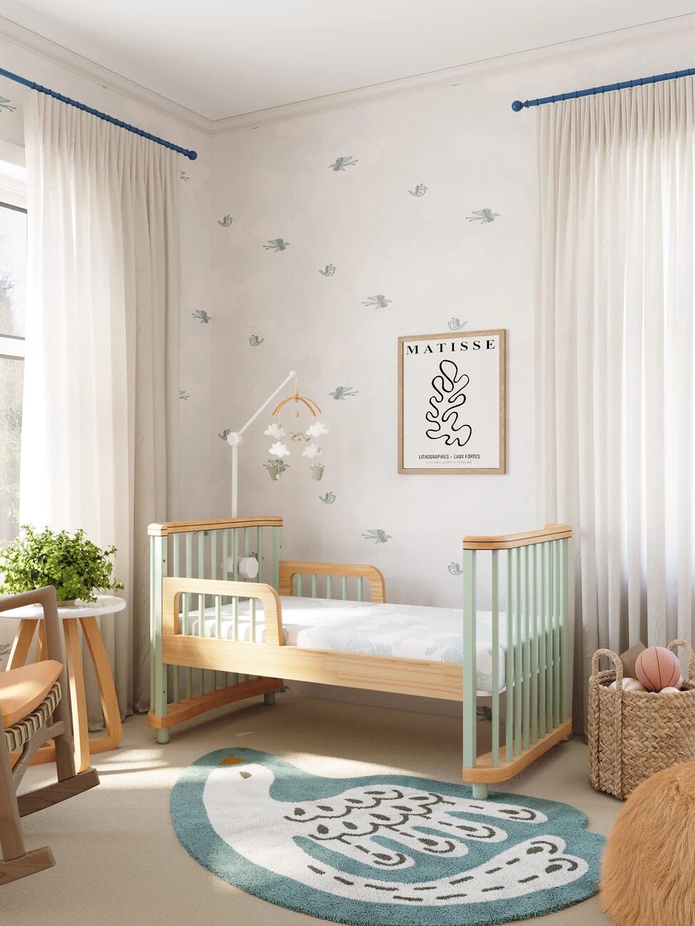 Toddler bed in mint green and natural wood in a bedroom