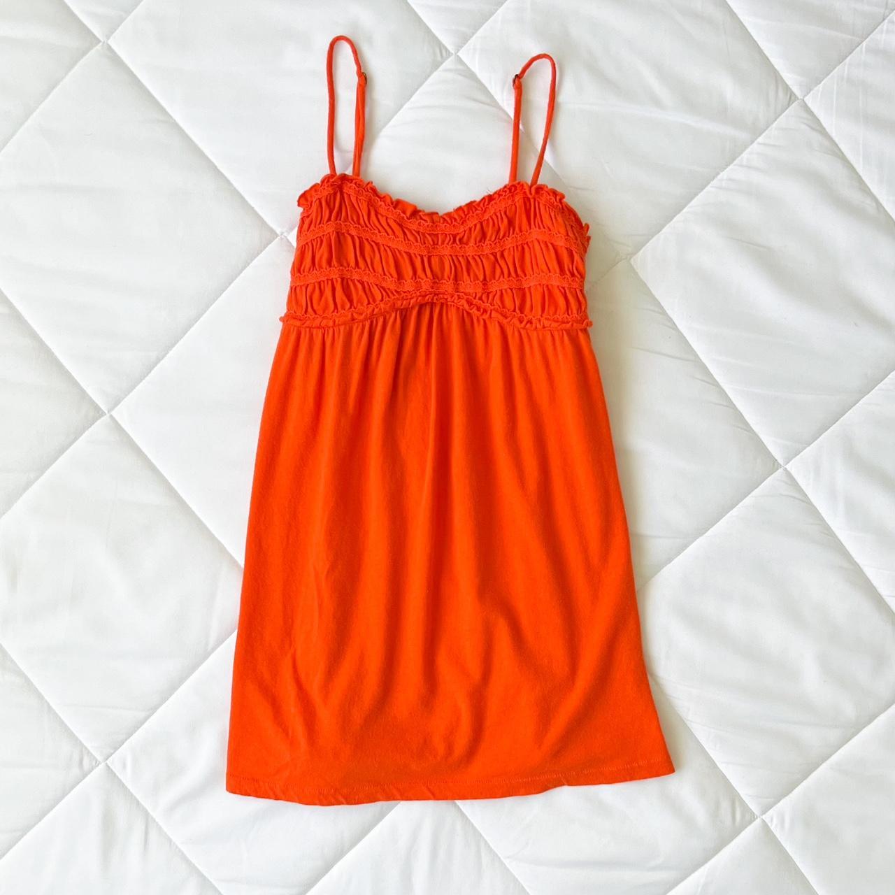 An orange slip dress