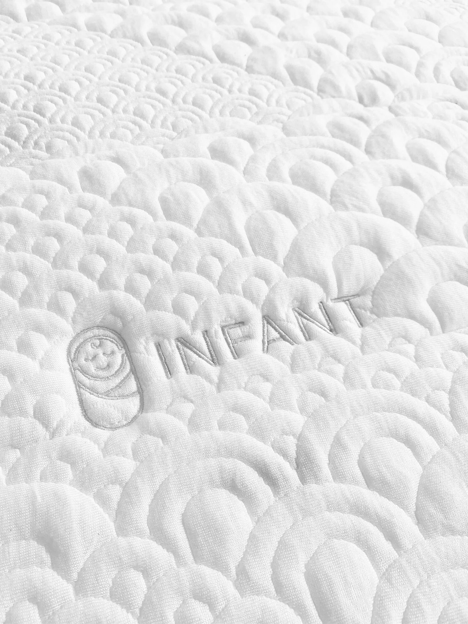 A close up shot of the Organic Dream crib mattress.