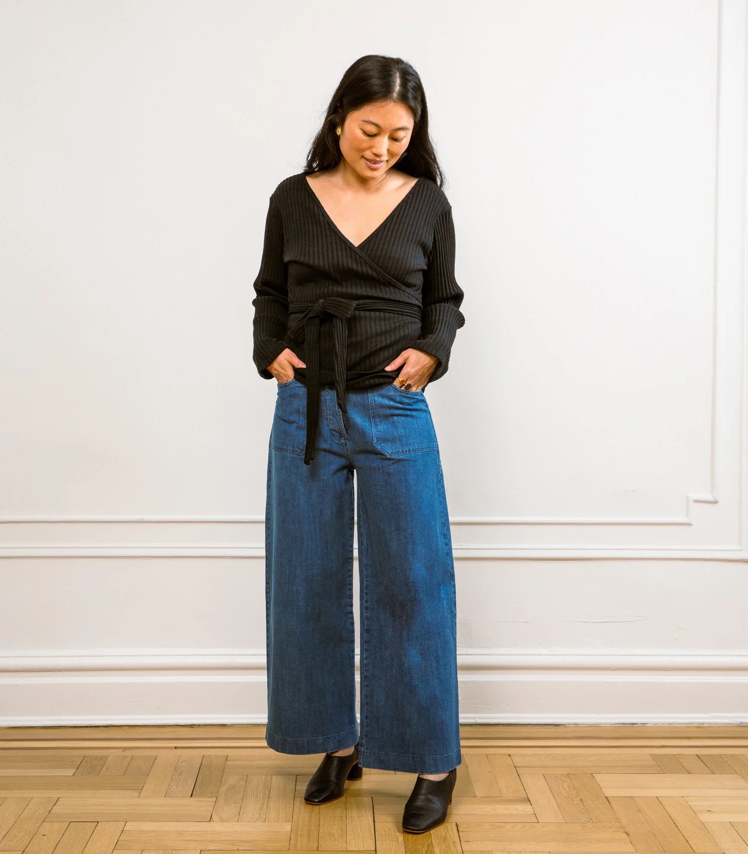 A model in wide leg American-made jeans.