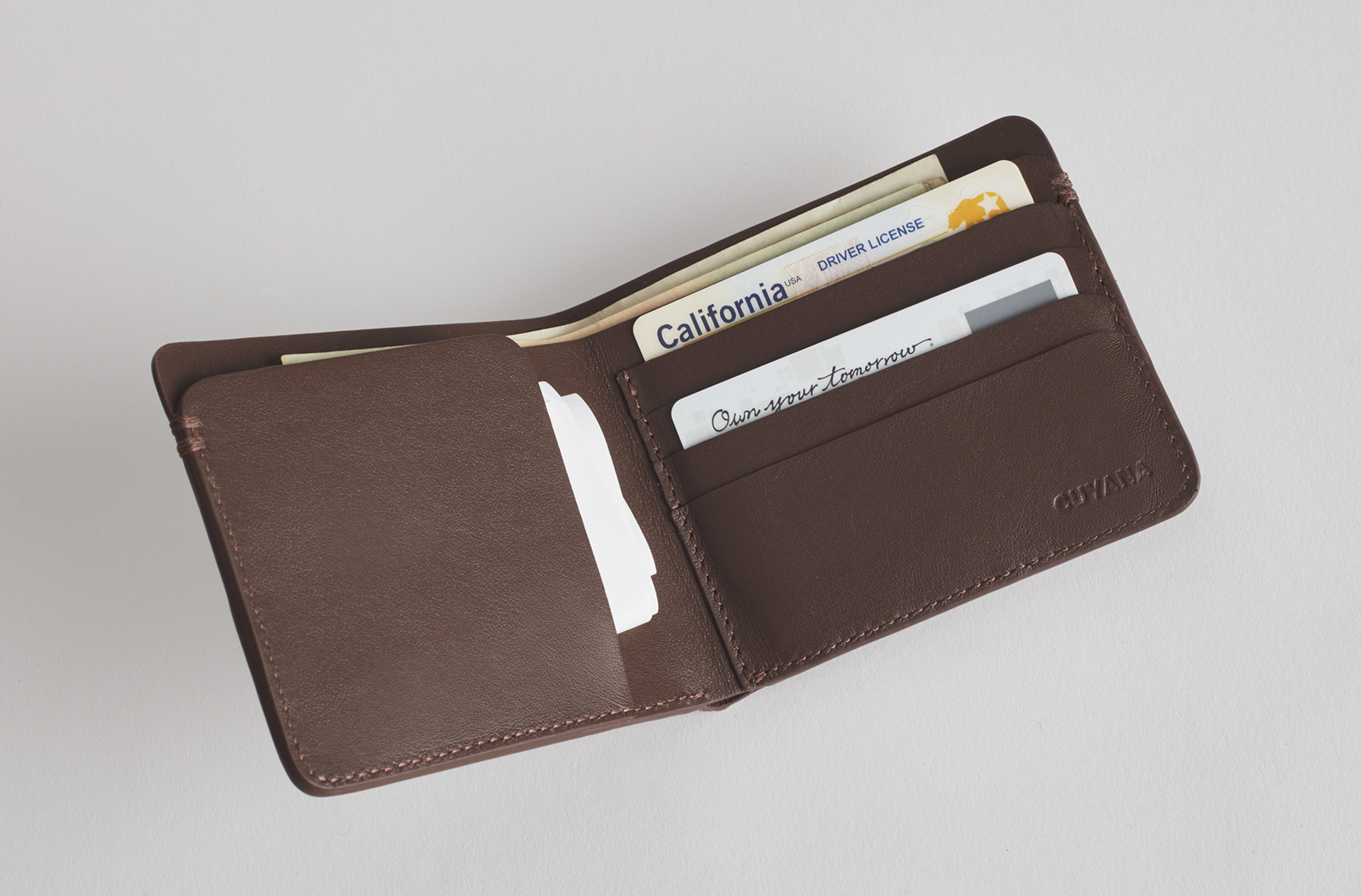 An open leather folding wallet. 