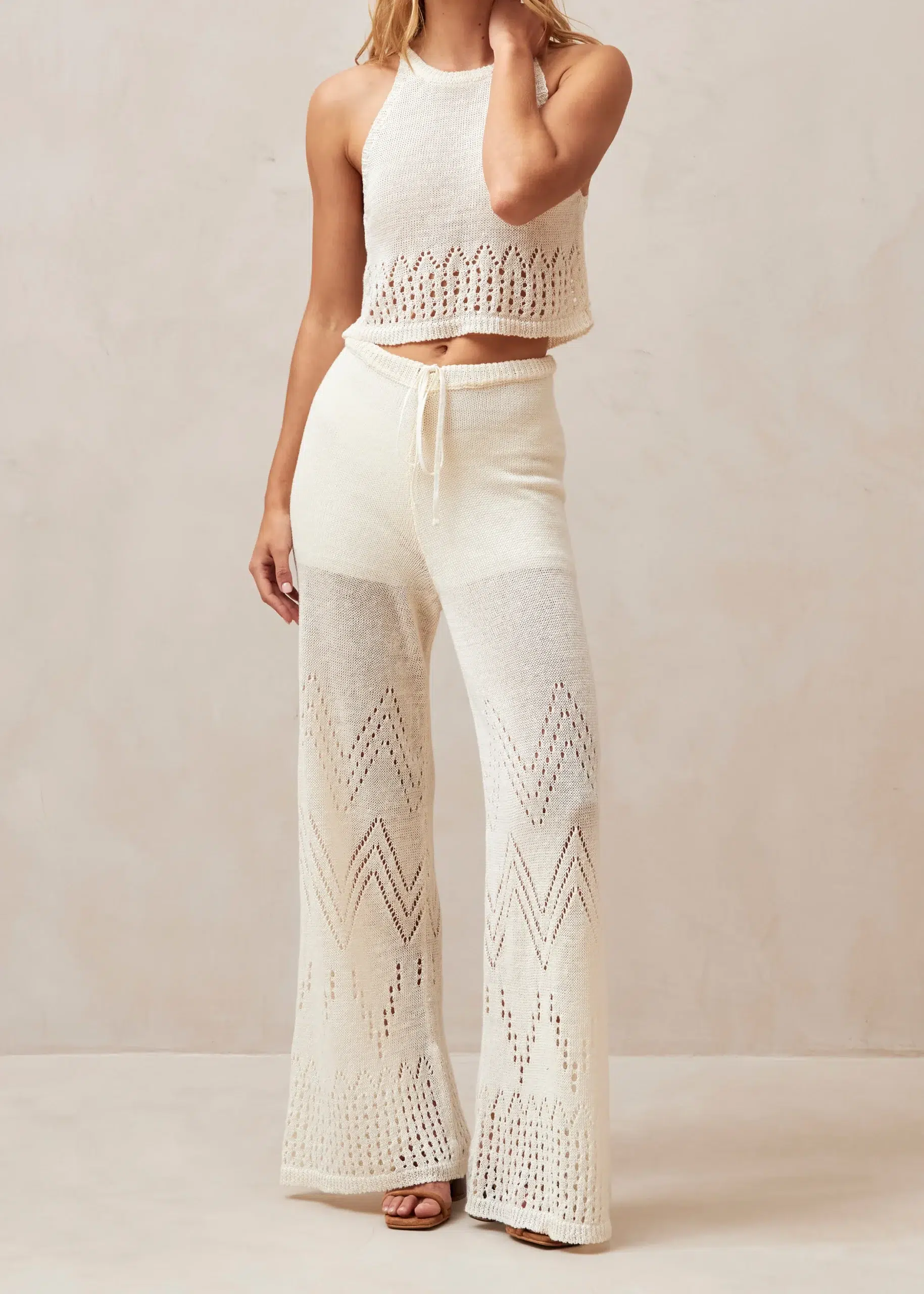 image of a body wearing a knit tank top and pants in cream color