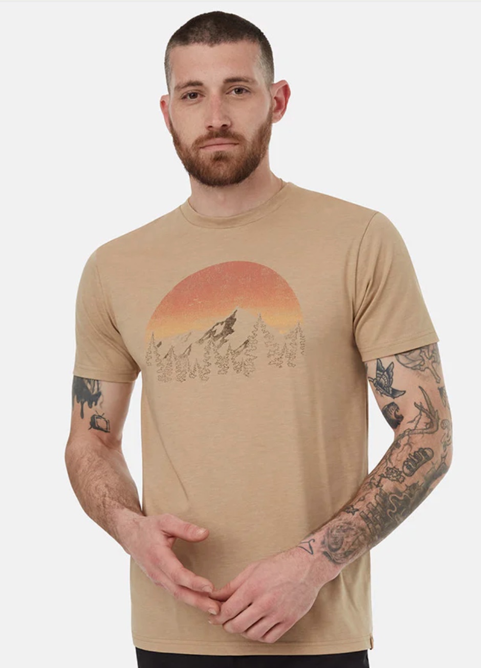 A model in a graphic tan tee shirt.
