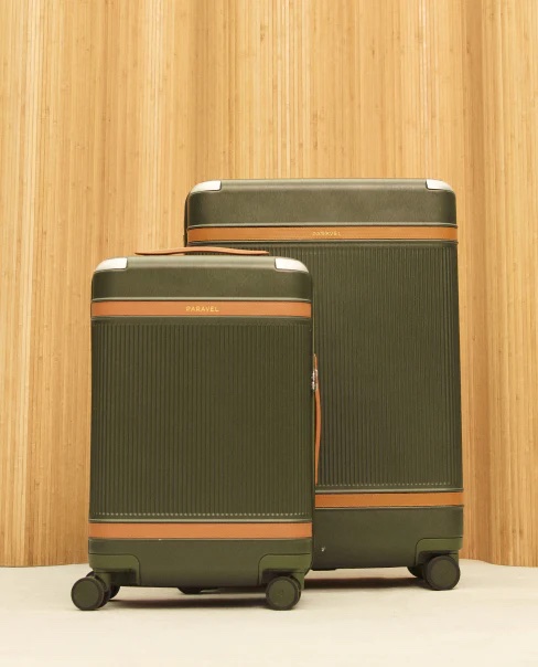 Two olive and tan cases sit next to each other against a woodgrain backdrop.