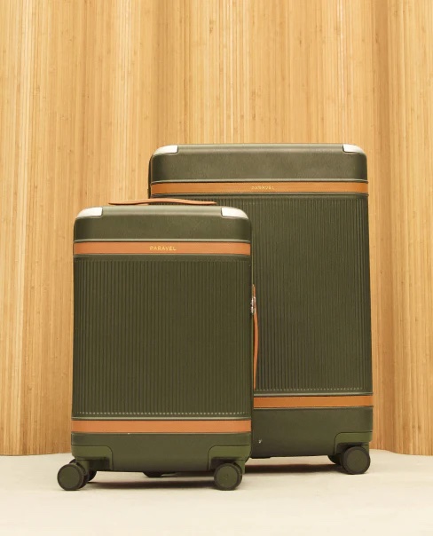 Two olive and tan cases sit next to each other against a woodgrain backdrop. 