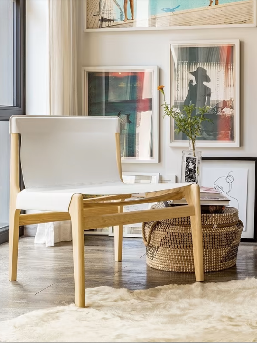 A wooden chair in a styled room. 