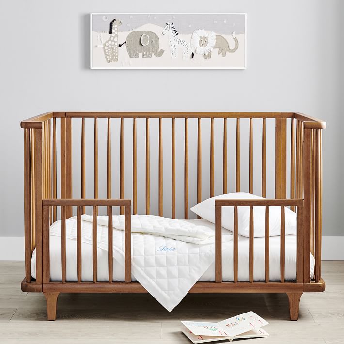 A toddler day bed in a nursery.