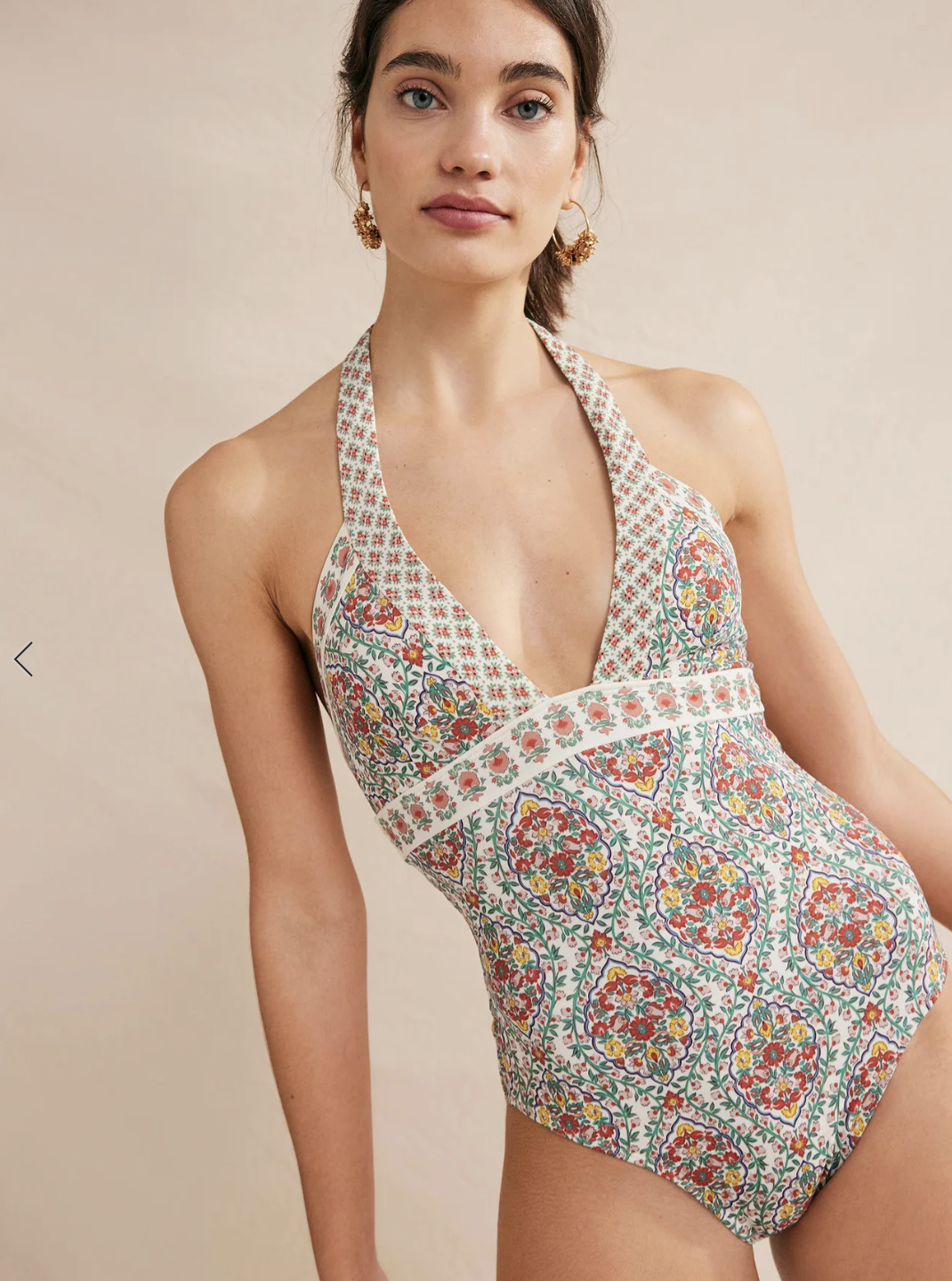 A model in a printed halter one piece.