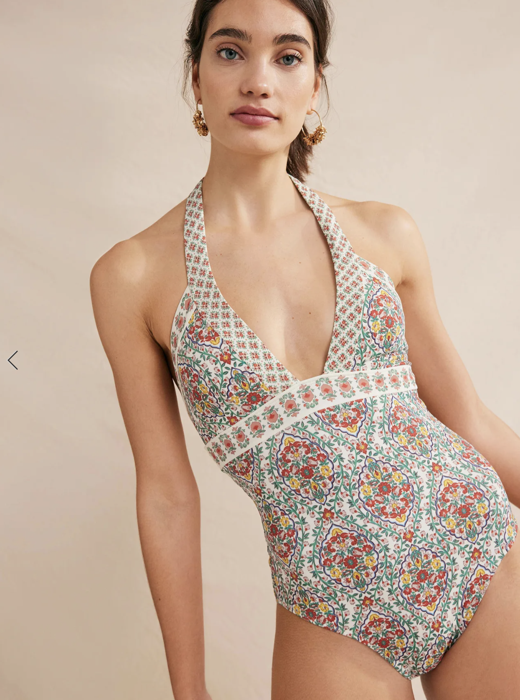 A model in a printed halter one piece. 