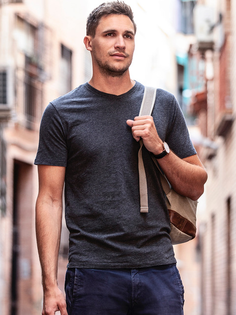 A model wearing Fair Indigo tee and jeans.