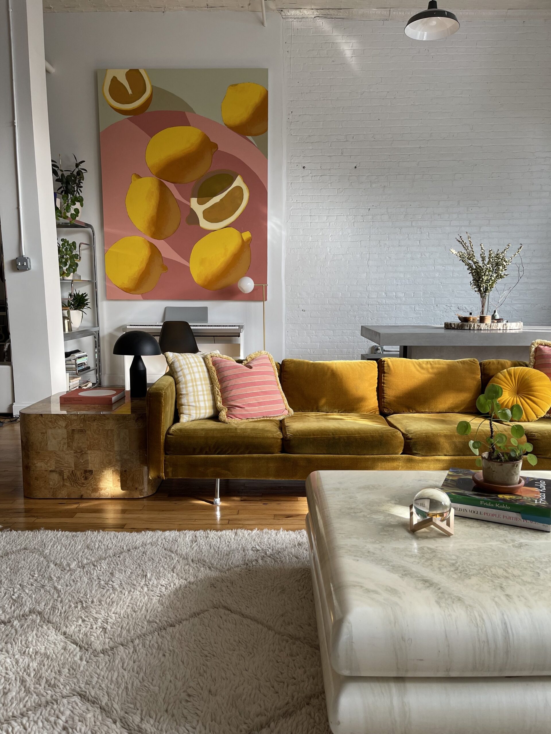 A yellow sofa purchased through Kaiyo set in a living room.