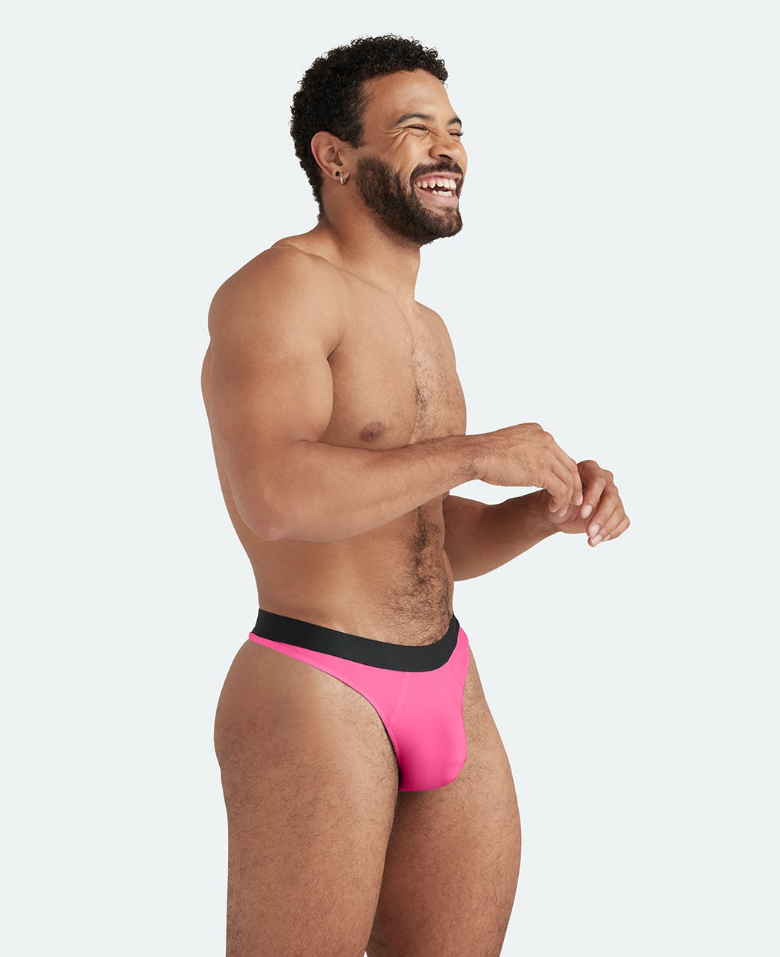 A model wears a pink thong.
