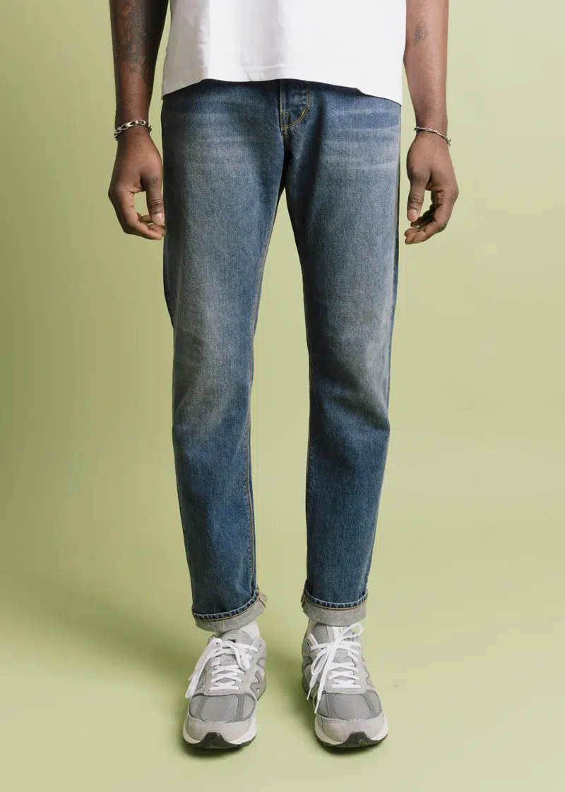 A model wearing American-made jeans from the front. 