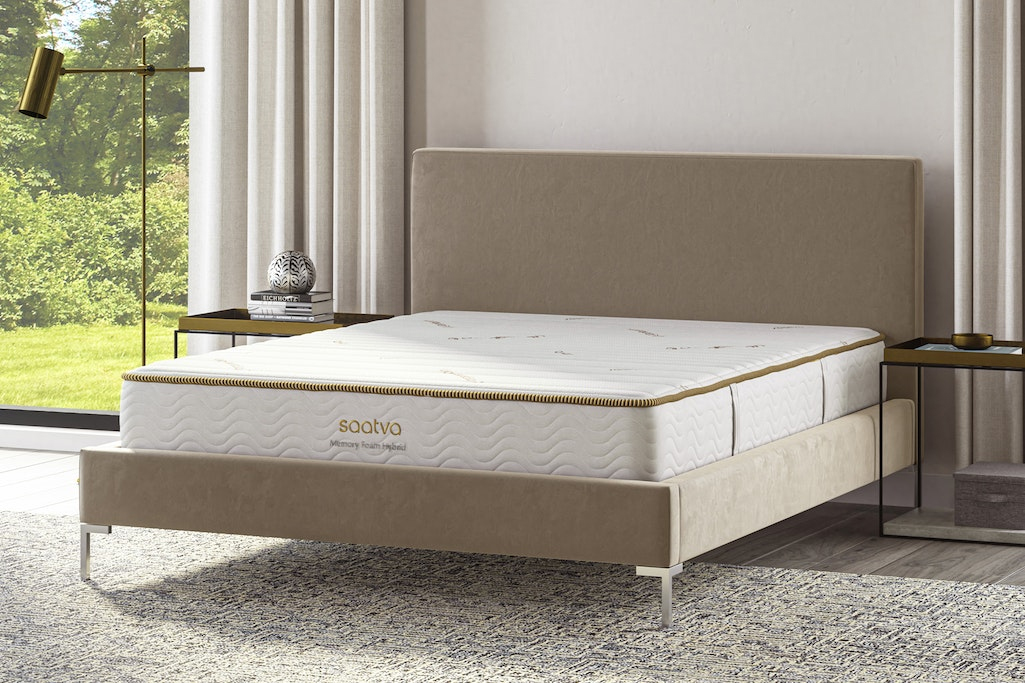 A bed with a Saatva mattress. 