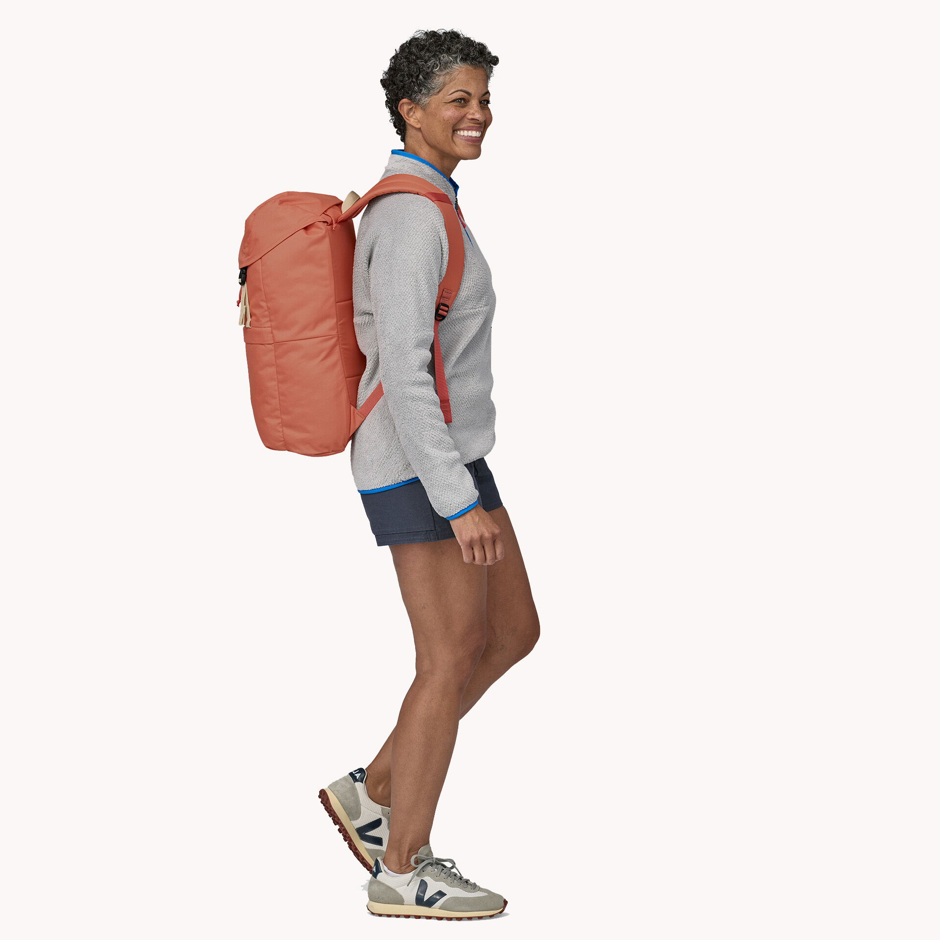 A model wearing a Patagonia backpack.