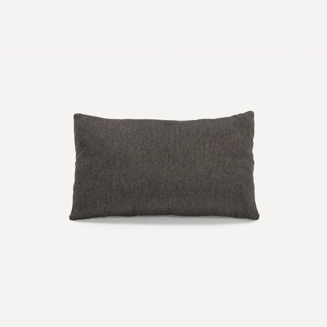A rectangular, dark grey textured pillow is centered on a plain white background.