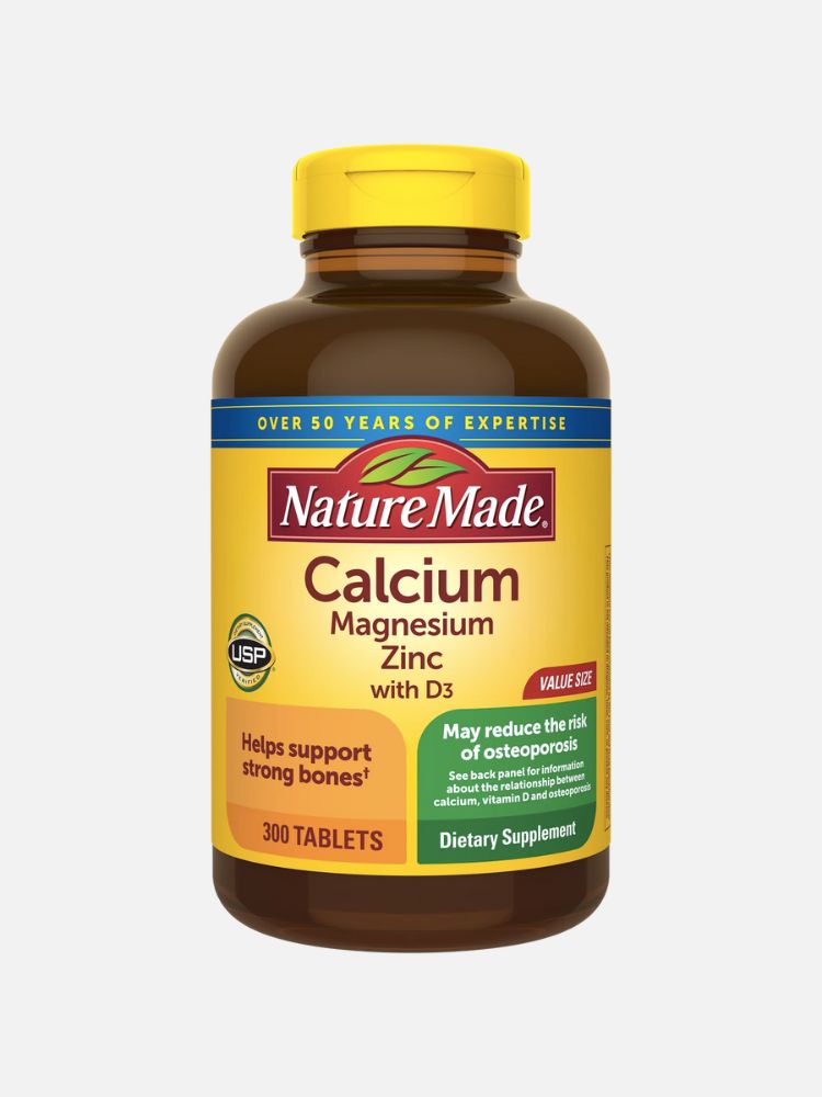 A bottle of Nature Made Calcium, Magnesium, Zinc and D3 tablets.
