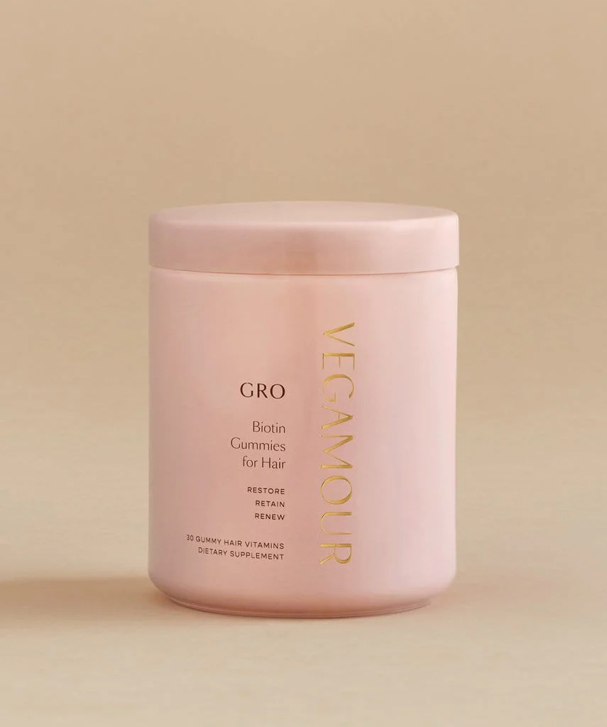 A pink jar of Vegamour gummies.