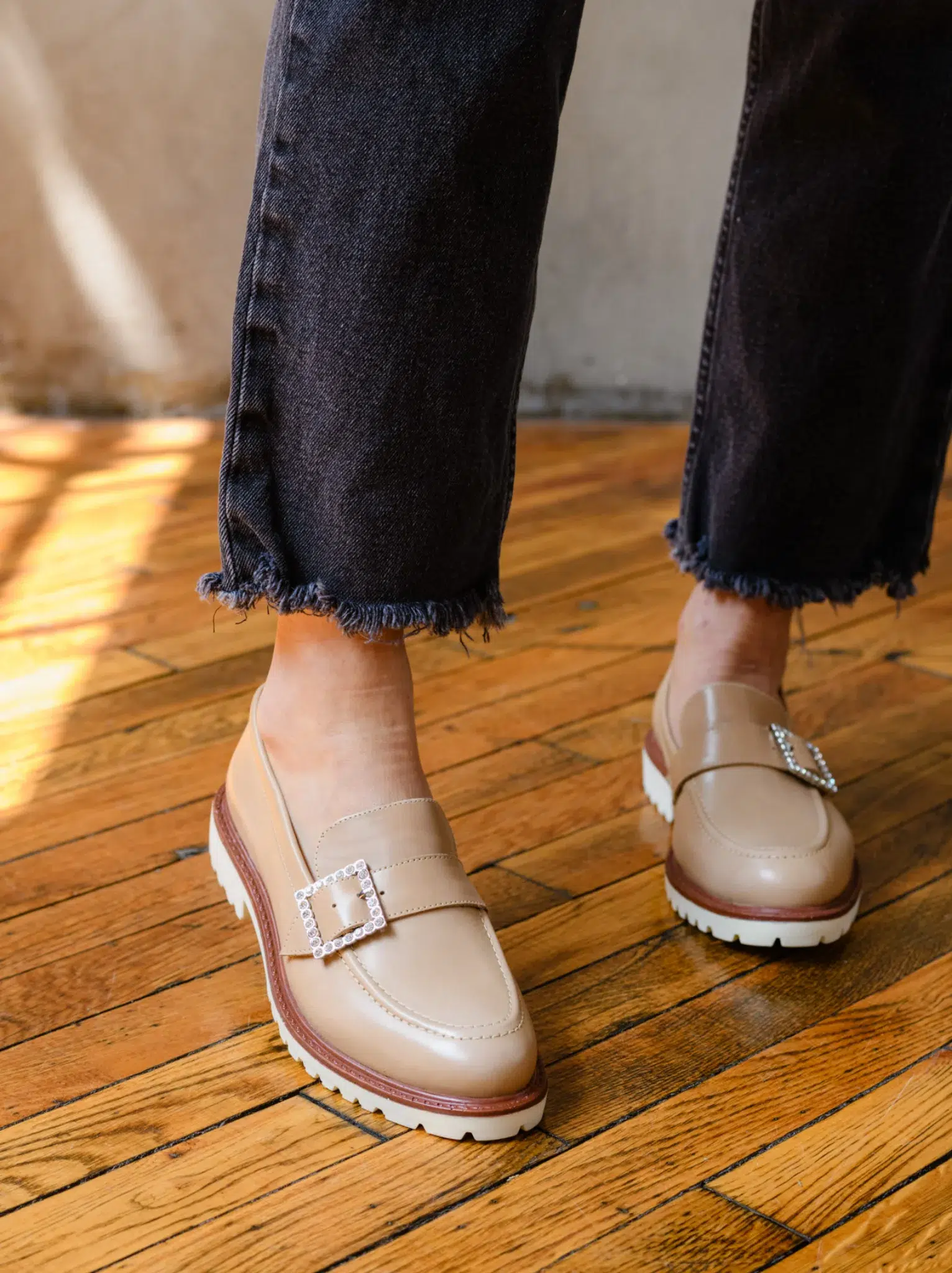 A model wearing ABLE sustainable loafers. 