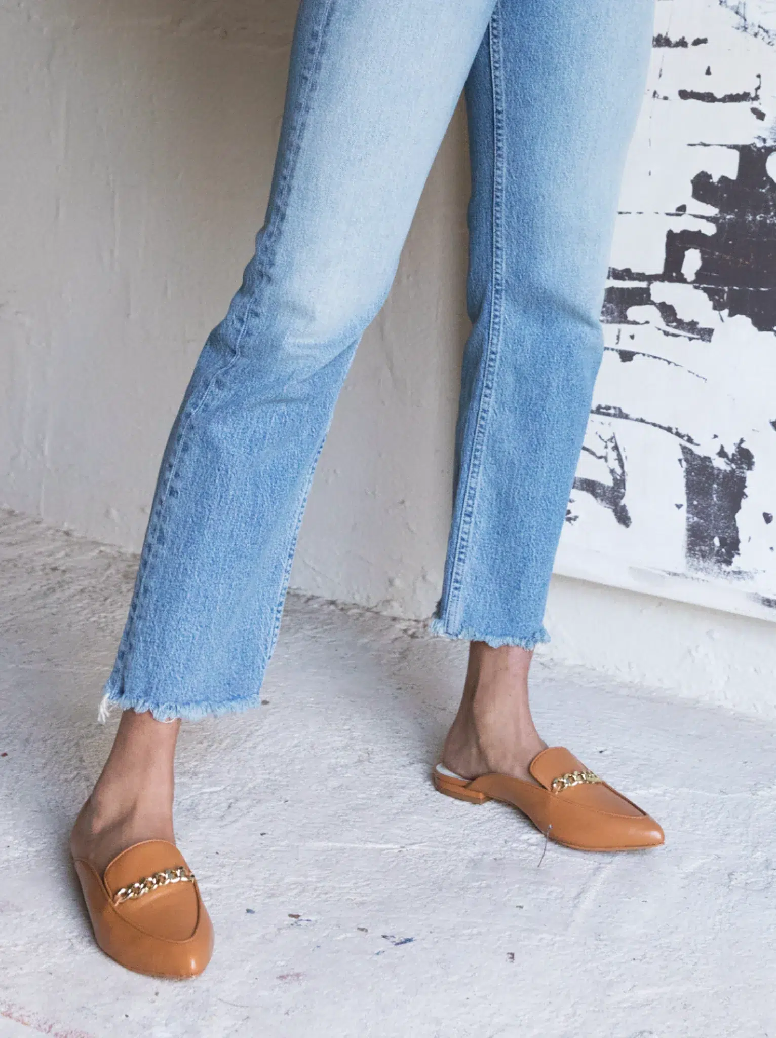 A model wearing ABLE sustainable loafers. 