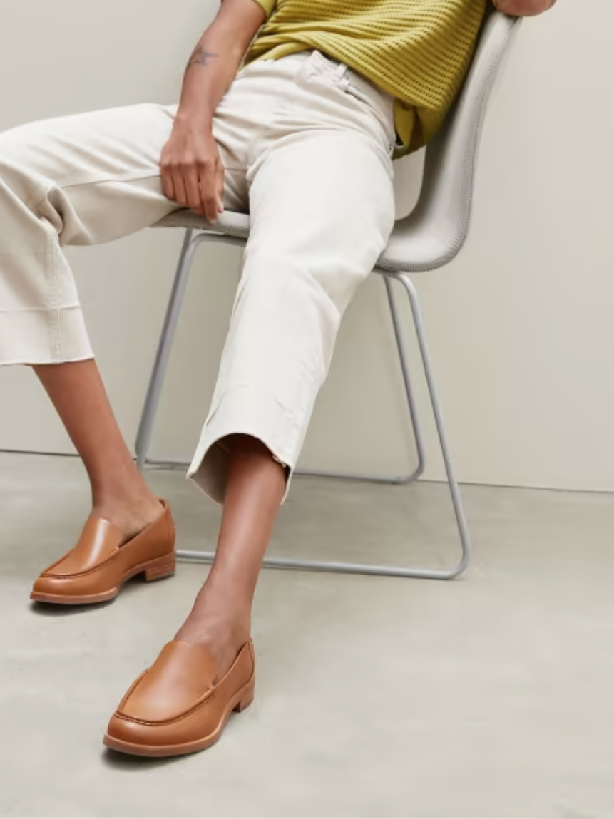 A model wearing Everlane sustainable loafers. 