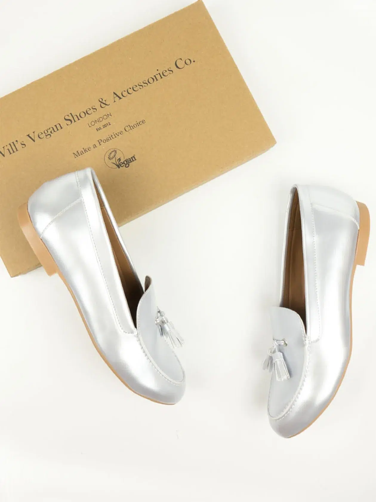 Will's Vegan Store sustainable silver loafers and their box.
