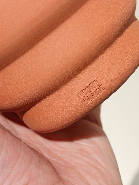 A close up of the Front Range logo on their Terracotta planter.