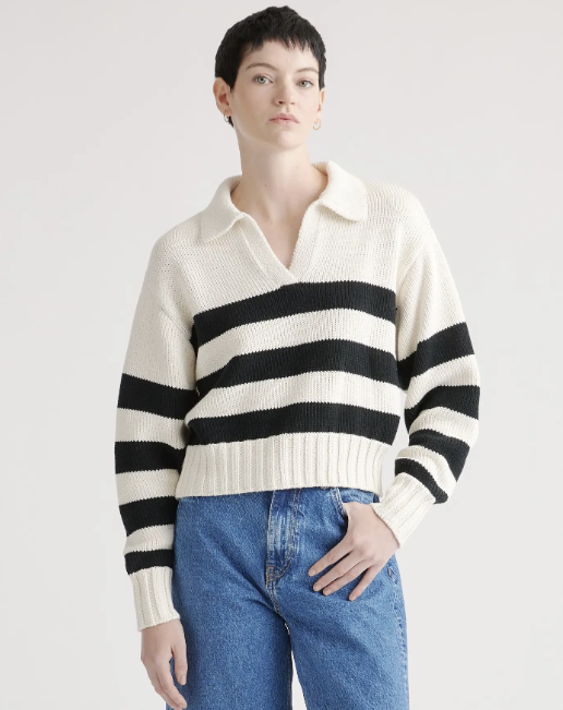 Model wearing a white polo long sleeve sweater with three black stripes from Quince