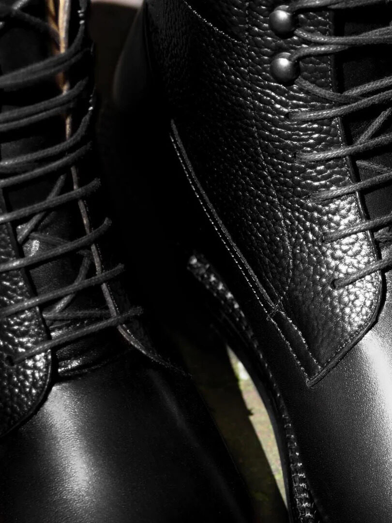 A close up of black Beckett Simonon boots. 