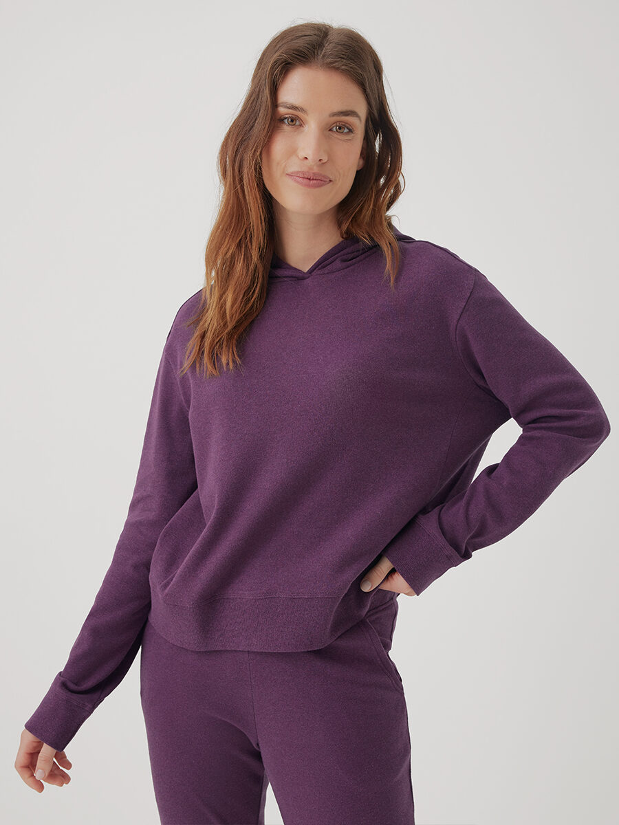A model wearing a purple Pact sweat set.