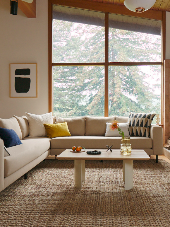 A light cream Sabai modular couch in a living room.