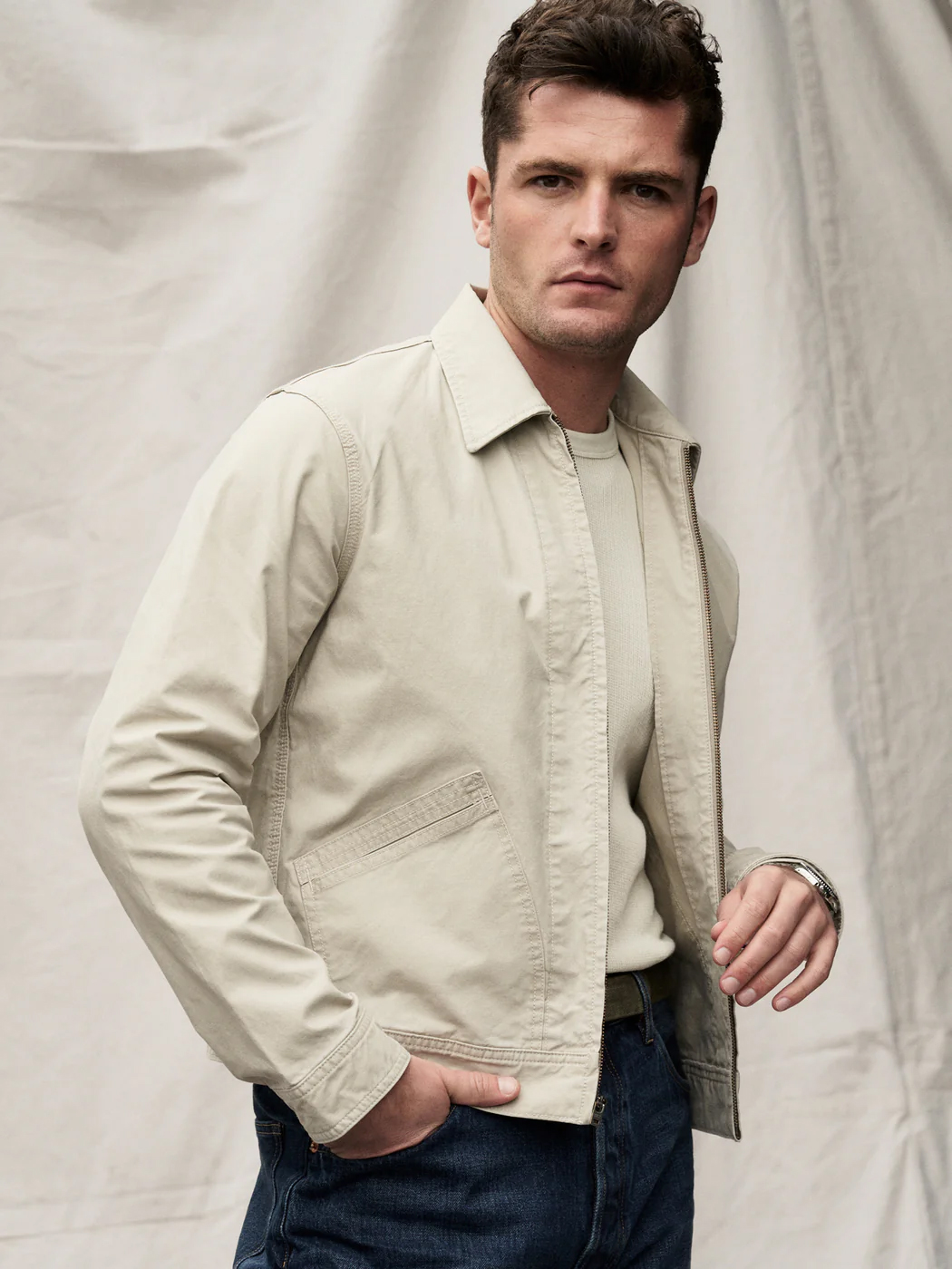 A model wearing a Buck Mason sustainable jacket for men
