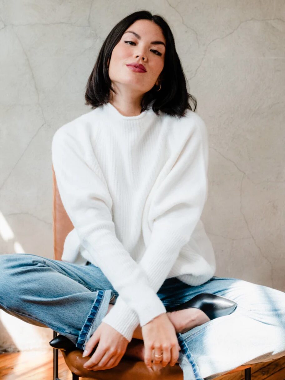 A model wearing a sustainable sweater from ABLE