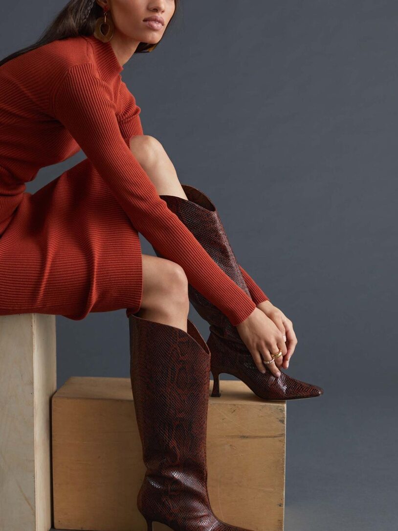 A model wearing sustainable boots from Alohas