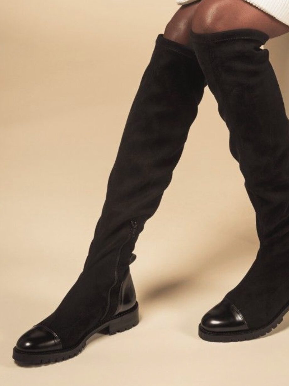A model wearing sustainable boots from Nae