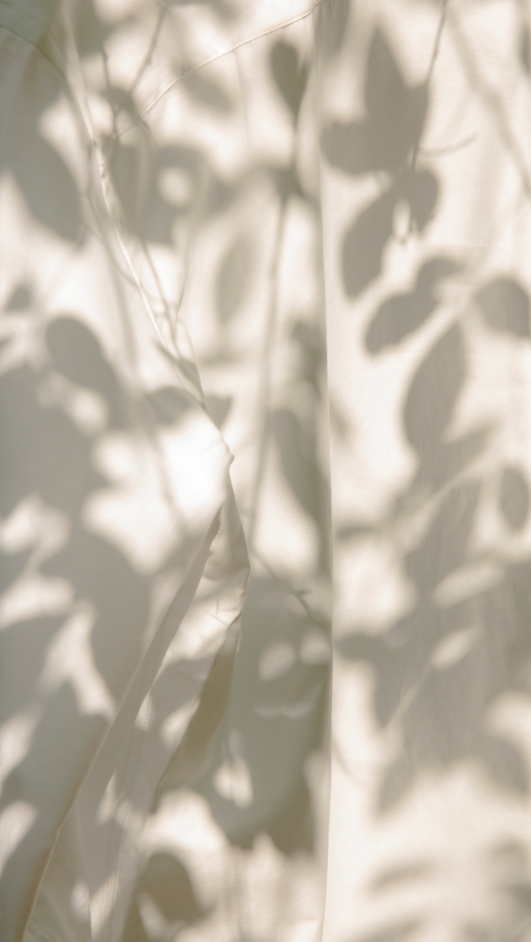 Botanical shadow on white garment